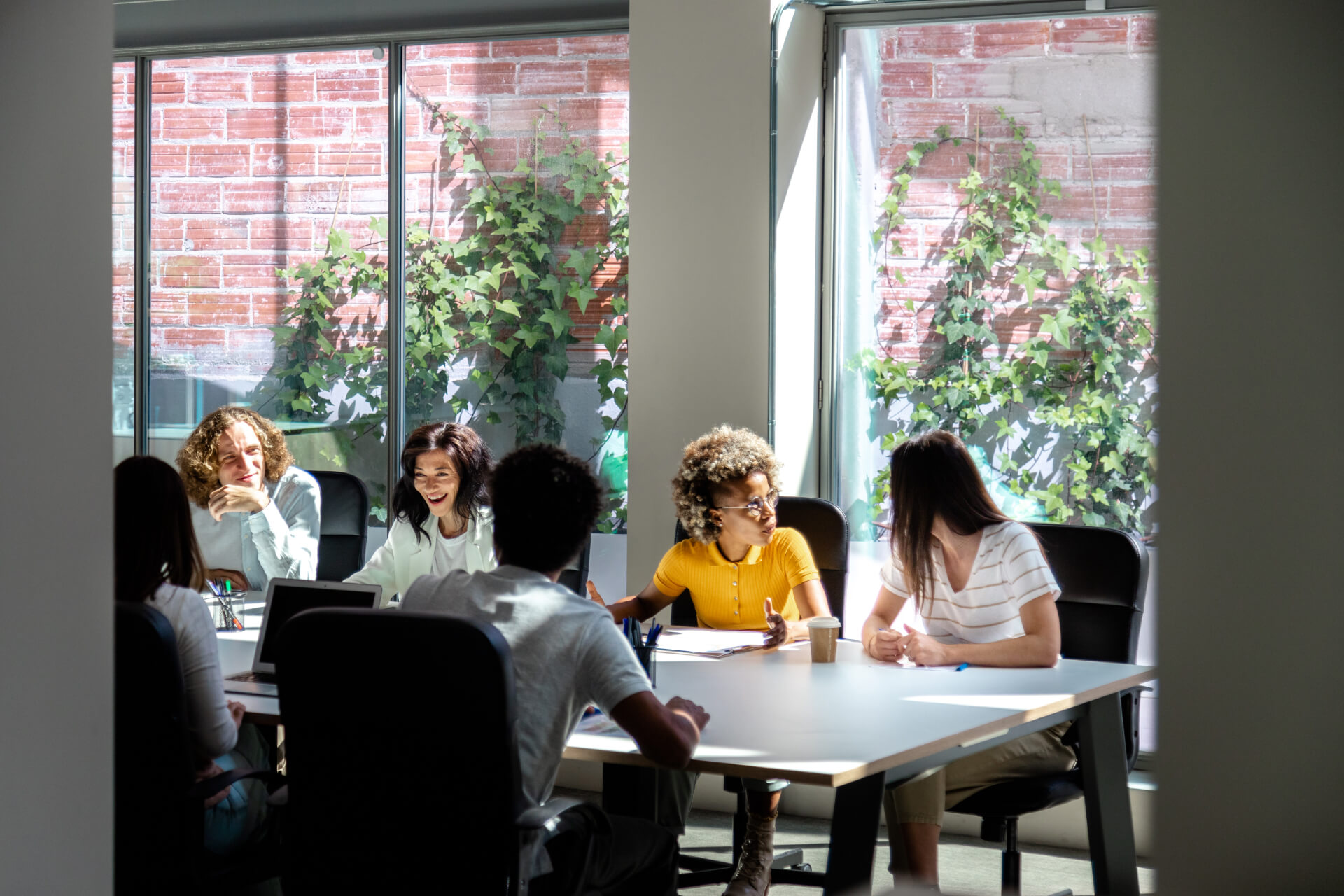 multiracial-group-of-colleagues-chat-in-office-co-2022-07-12-17-12-22-utc 1