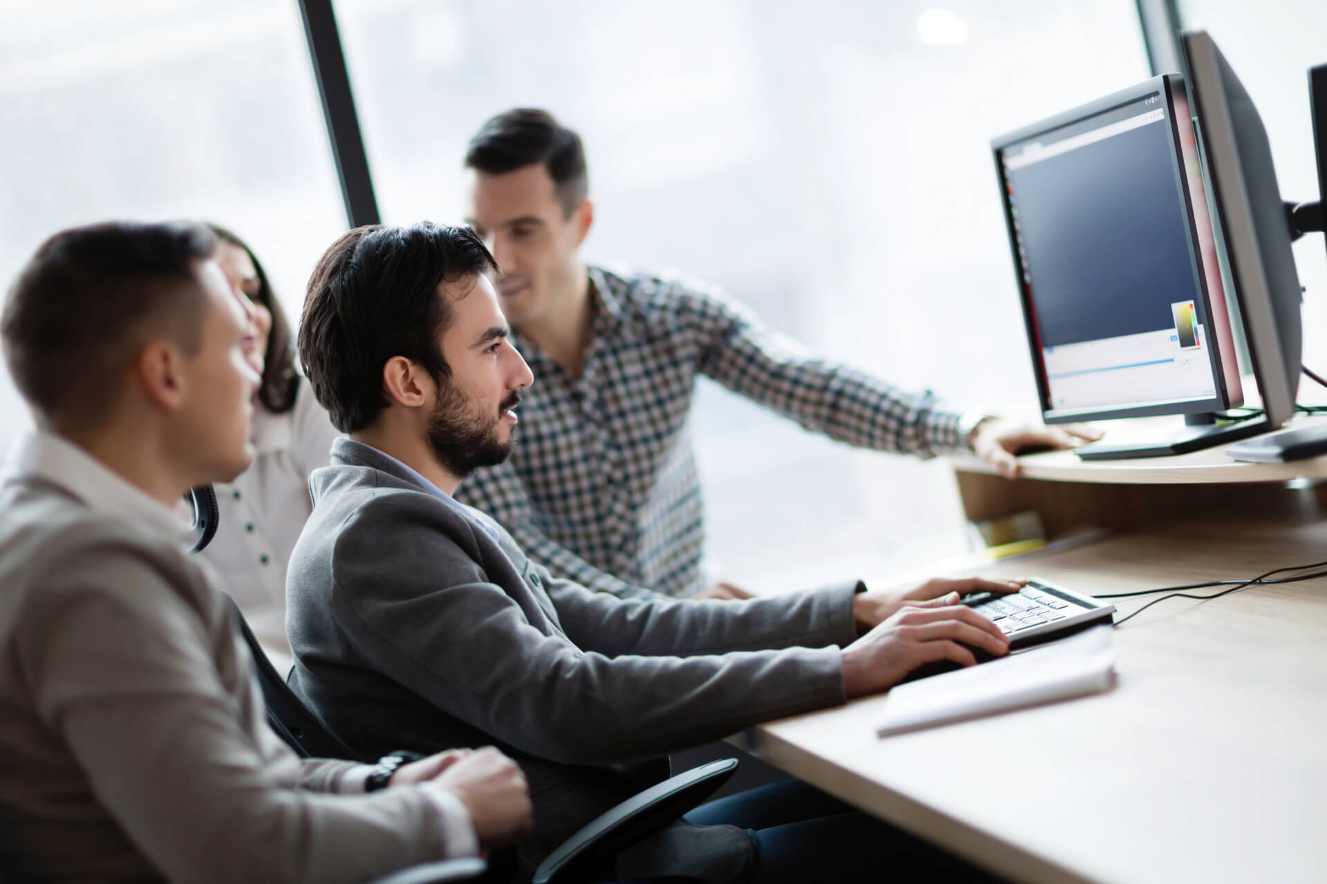 young-businesspeople-working-on-computer-in-office-2021-08-30-02-31-37-utc 1